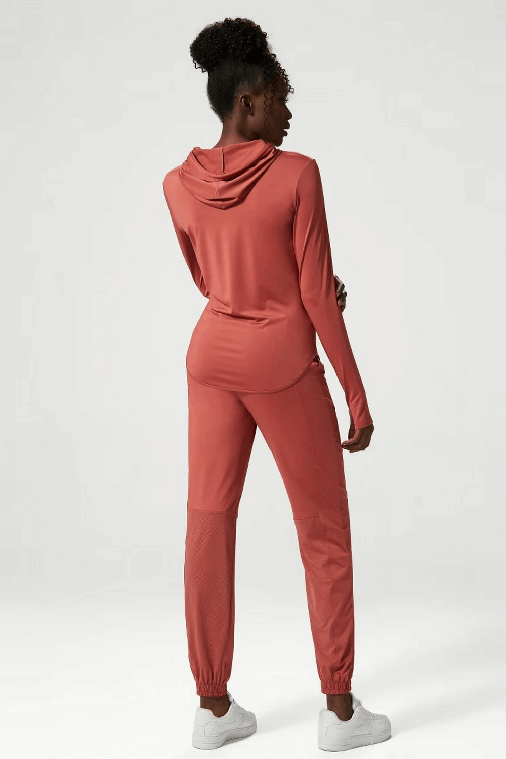 Athletic clothing set for women in three tones, back view, featuring a stylish and breathable design perfect for gym or leisure wear.